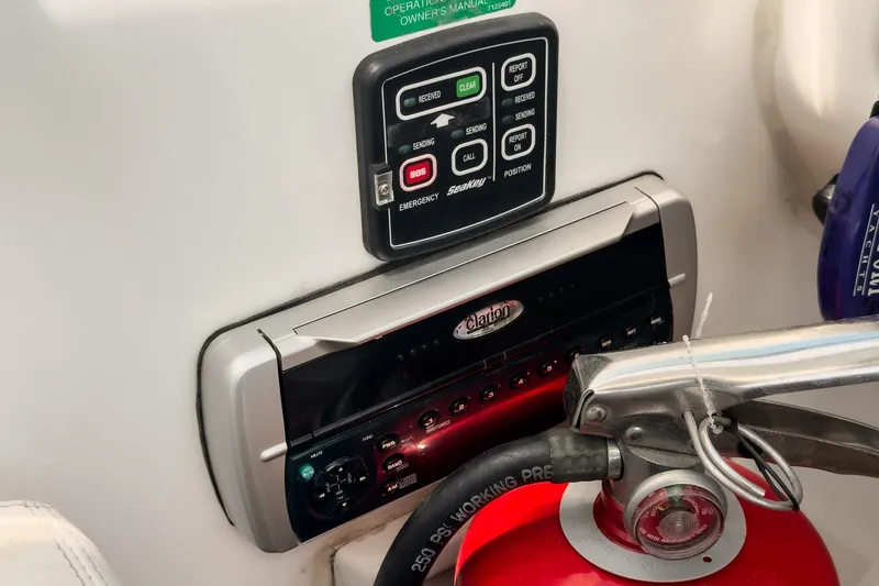 Slide: The Image of Control panel and fire extinguisher on 2003 Carver 530 Voyager Pilothouse yacht. - 71