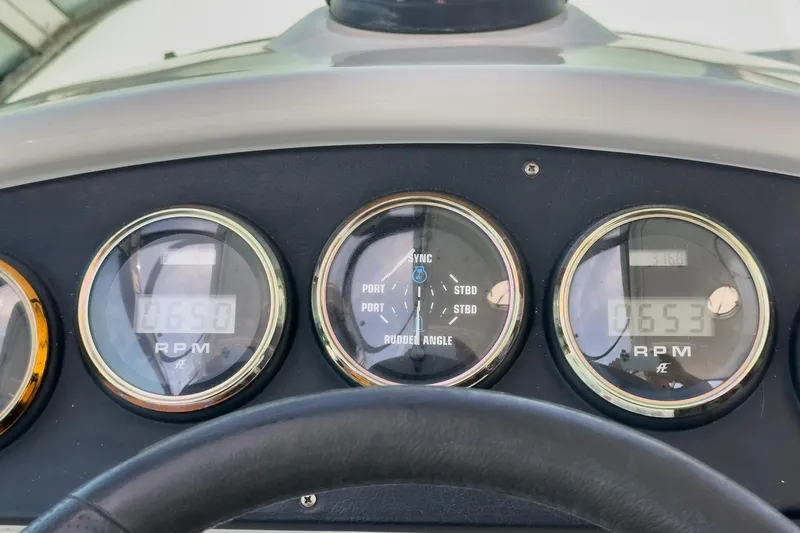 Slide: The Image of Dashboard gauges of a 2003 Carver 530 Voyager Pilothouse boat. - 72