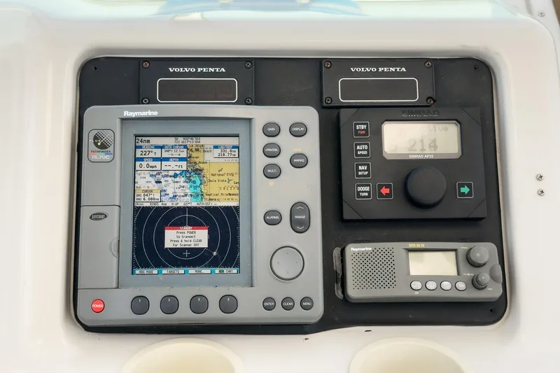 Slide: The Image of Control panel of a 2003 Carver 530 Voyager Pilothouse with navigation equipment. - 76