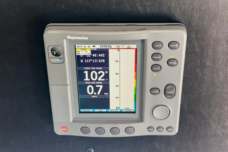 Slide: The Image of Raymarine marine navigation display on 2003 Carver 530 Voyager Pilothouse, showing course and speed. - 77
