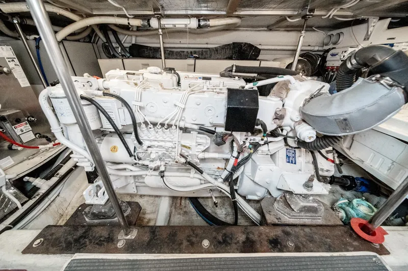 Slide: The Image of Engine room of 2003 Carver 530 Voyager Pilothouse, showcasing detailed mechanical components. - 78