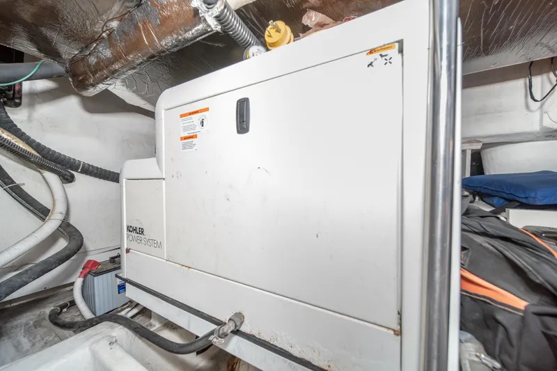 Slide: The Image of Engine room of 2003 Carver 530 Voyager Pilothouse with Kohler power system. - 79