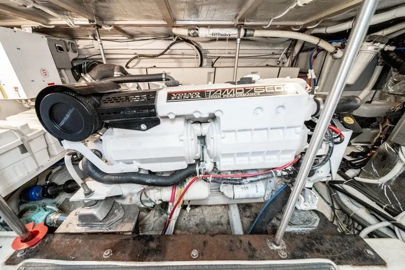 Slide: The Image of Engine room of 2003 Carver 530 Voyager Pilothouse with Volvo Penta engine. - 82