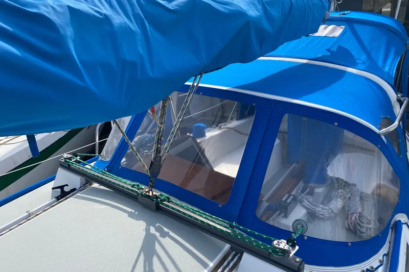 Slide: The Image of Catalina 30 MkII sailboat, 1987 model, featuring blue canvas cover and rigging details. - 5