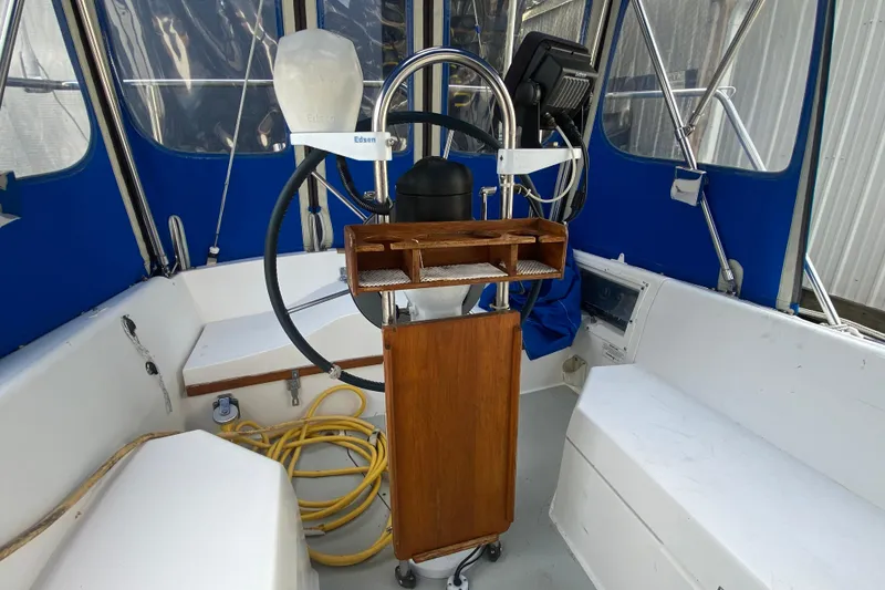Slide: The Image of Cockpit of 1987 Catalina 30 MkII sailboat with blue canvas and steering wheel. - 9