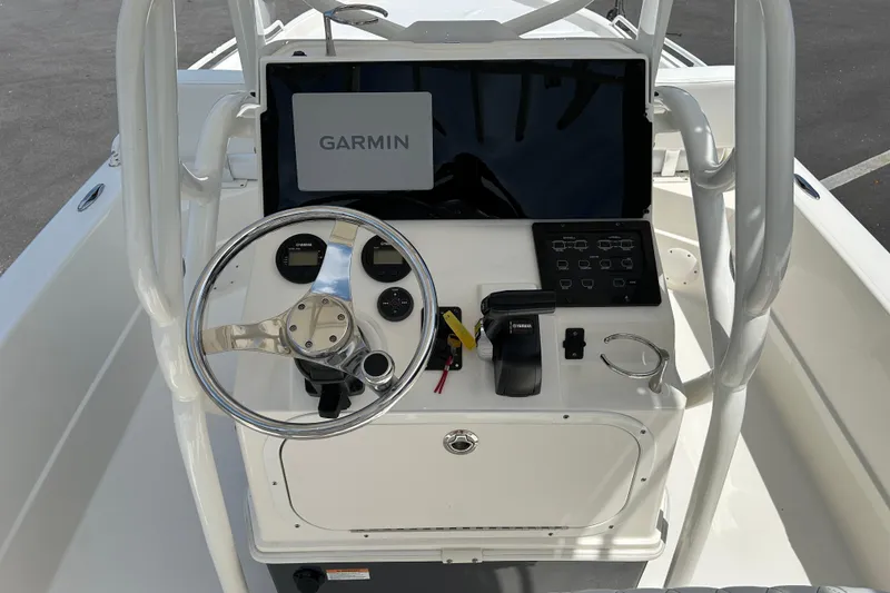 Slide: The Image of 2022 Skeeter SX2250 boat console with Garmin display and steering wheel. - 11