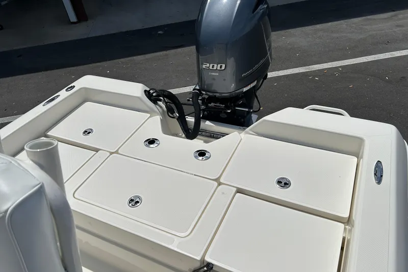 Slide: The Image of 2022 Skeeter SX2250 boat with Yamaha 200 engine, featuring spacious deck layout. - 13