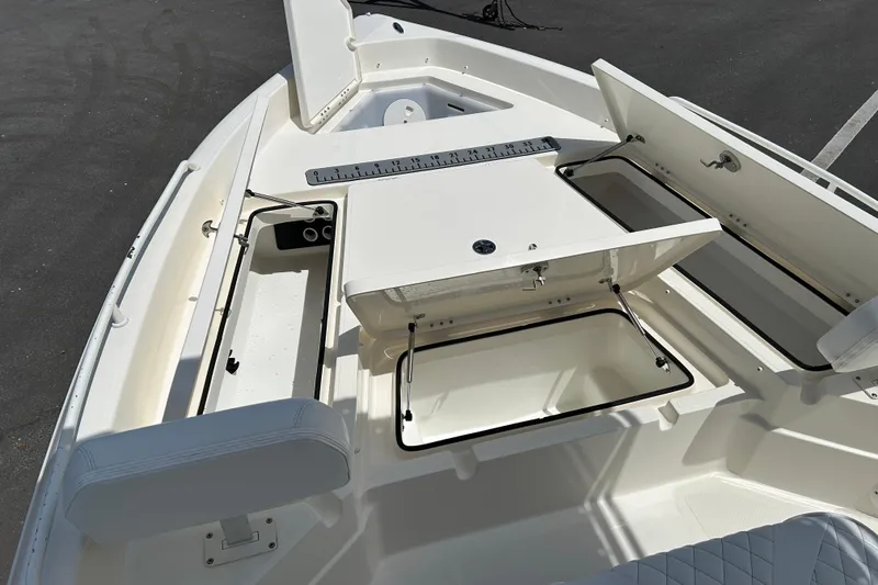 Slide: The Image of 2022 Skeeter SX2250 boat interior with open storage compartments and seating. - 14