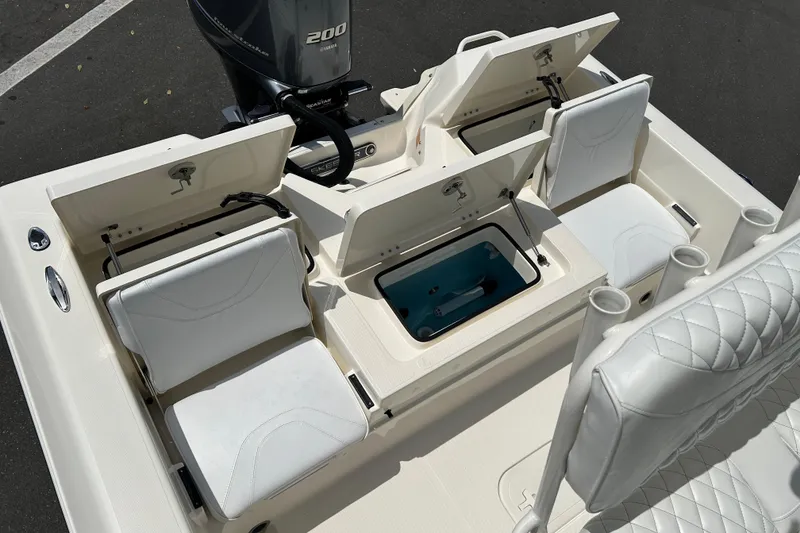 Slide: The Image of 2022 Skeeter SX2250 boat interior with storage compartments and seating. - 16