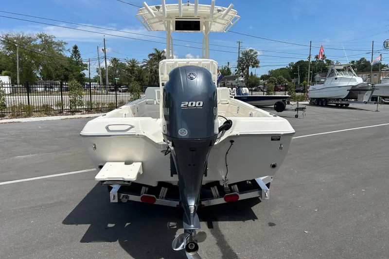 Slide: The Image of 2022 Skeeter SX2250 boat with Yamaha 200 engine, parked outdoors on a sunny day. - 3