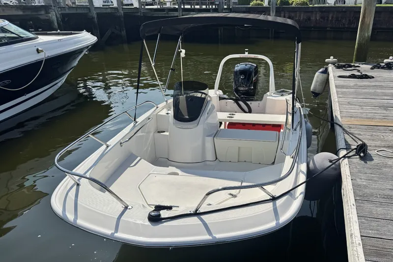 Slide: The Image of A 2027 Boston Whaler 160 Super Sport docked. It features a sleek, modern design. - 5
