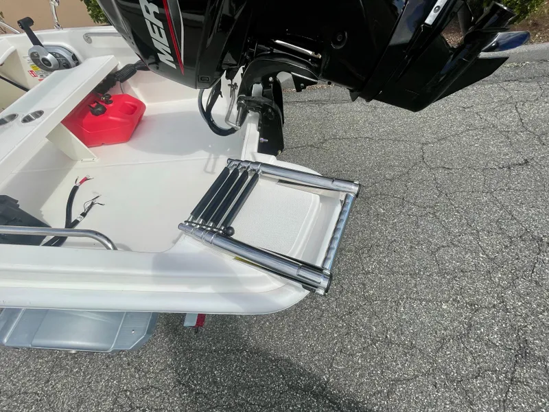 Slide: The Image of A swim ladder is mounted at the stern of a 2027 Boston Whaler 130 Super Sport. - 3
