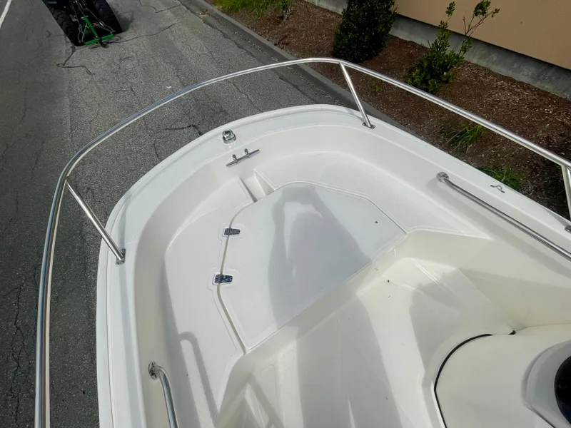 Slide: The Image of The image shows the bow of a 2027 Boston Whaler 130 Super Sport with stainless steel railing. - 11