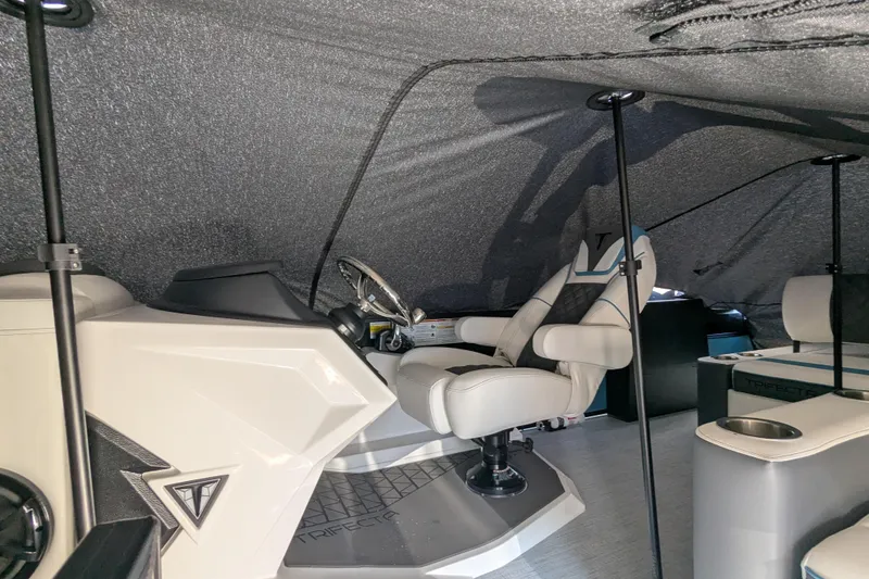 Slide: The Image of Interior of 2026 Trifecta 23SB2 SS boat with steering wheel and seating. - 3