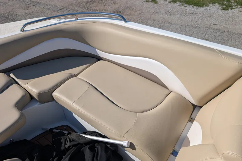 Slide: The Image of 2017 Hurricane SunDeck Sport 202 IO boat interior with beige and white cushioned seating. - 6