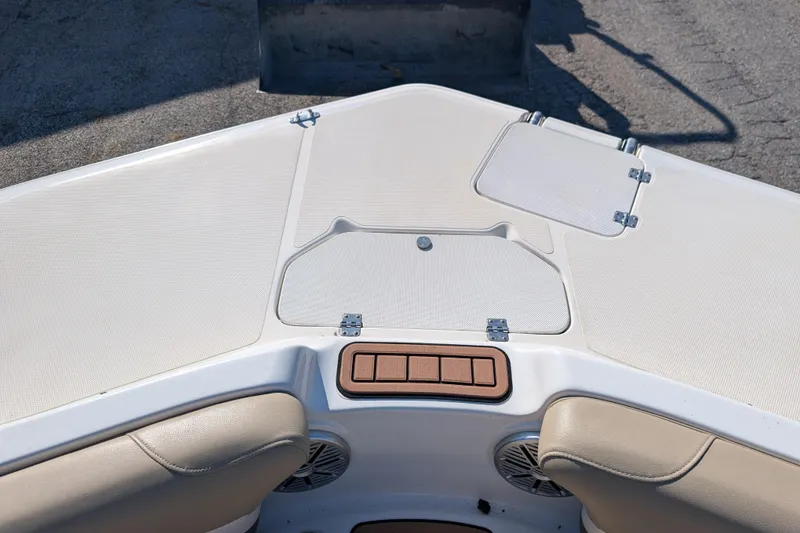 Slide: The Image of 2017 Hurricane SunDeck Sport 202 IO boat deck with storage compartments and seating. - 8