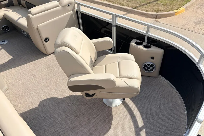 Slide: The Image of Luxurious seating on 2025 Sun Tracker SportFish 20 DLX pontoon boat, featuring beige upholstery. - 15