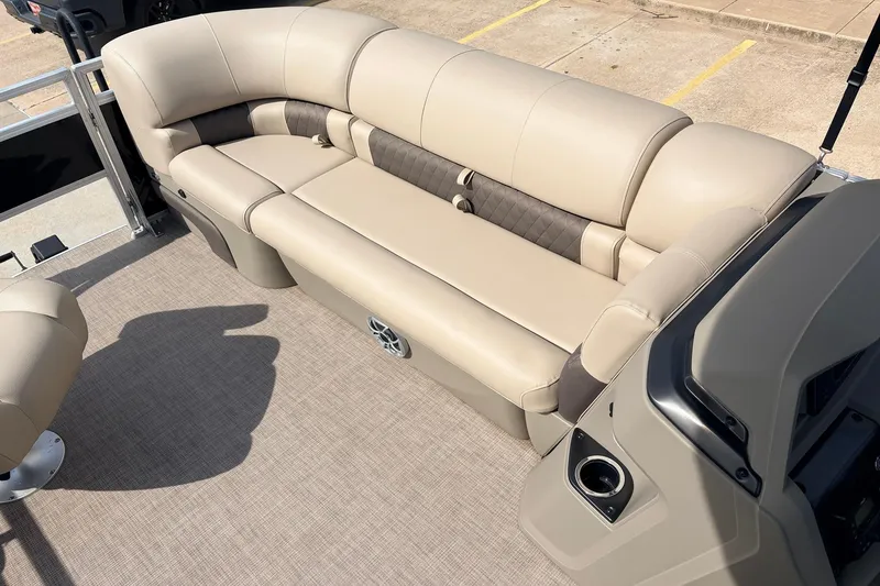Slide: The Image of 2025 Sun Tracker SportFish 20 DLX pontoon boat with beige seating and modern interior design. - 16