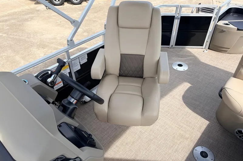 Slide: The Image of Captain's chair on 2025 Sun Tracker SportFish 20 DLX pontoon boat, beige upholstery. - 29