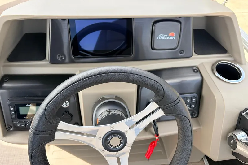 Slide: The Image of Steering console of 2025 Sun Tracker SportFish 20 DLX with modern controls and display. - 31