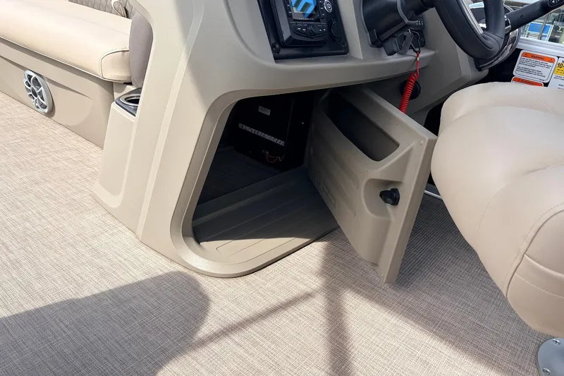 Slide: The Image of 2025 Sun Tracker SportFish 20 DLX boat interior with open storage compartment. - 33