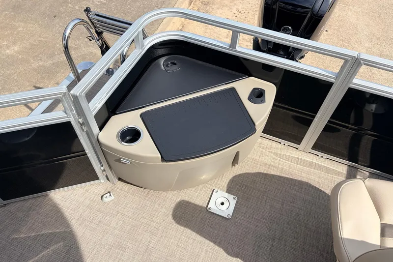 Slide: The Image of 2025 Sun Tracker SportFish 20 DLX boat interior with fishing station and cup holder. - 37