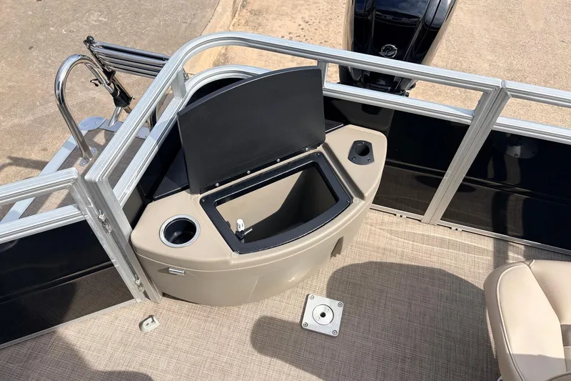 Slide: The Image of 2025 Sun Tracker SportFish 20 DLX boat interior with storage compartment and cup holder. - 38