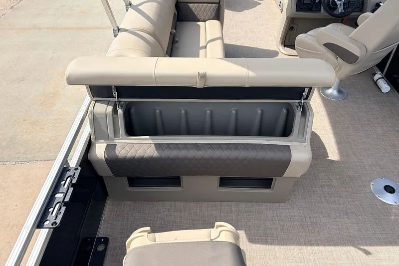 Slide: The Image of Interior of 2025 Sun Tracker SportFish 20 DLX pontoon boat with open storage compartment. - 40