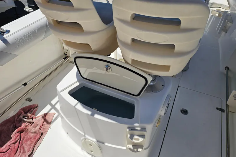 Slide: The Image of Control panel of a 2012 Boston Whaler 220 Outrage boat with switches and breakers. - 24