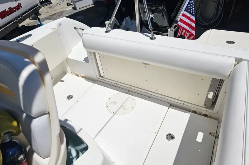Slide: The Image of 2012 Boston Whaler 220 Outrage boat interior with seating and Mercury engine. - 28