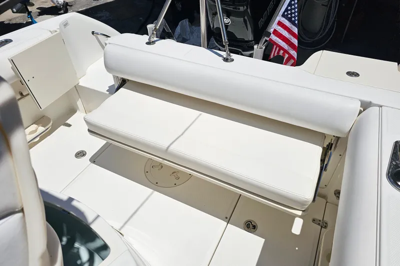 Slide: The Image of Open storage compartment on a 2012 Boston Whaler 220 Outrage boat. - 29