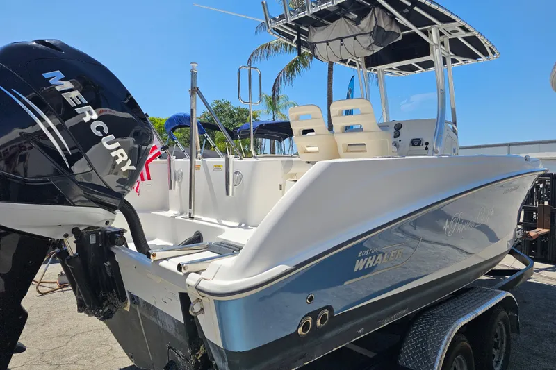 Slide: The Image of 2012 Boston Whaler 220 Outrage boat with Mercury engine on trailer. - 7