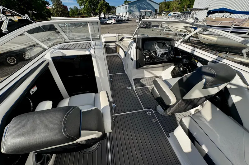 Slide: The Image of 2019 Yamaha Boats 242 Limited S interior with sleek seating and modern dashboard. - 5