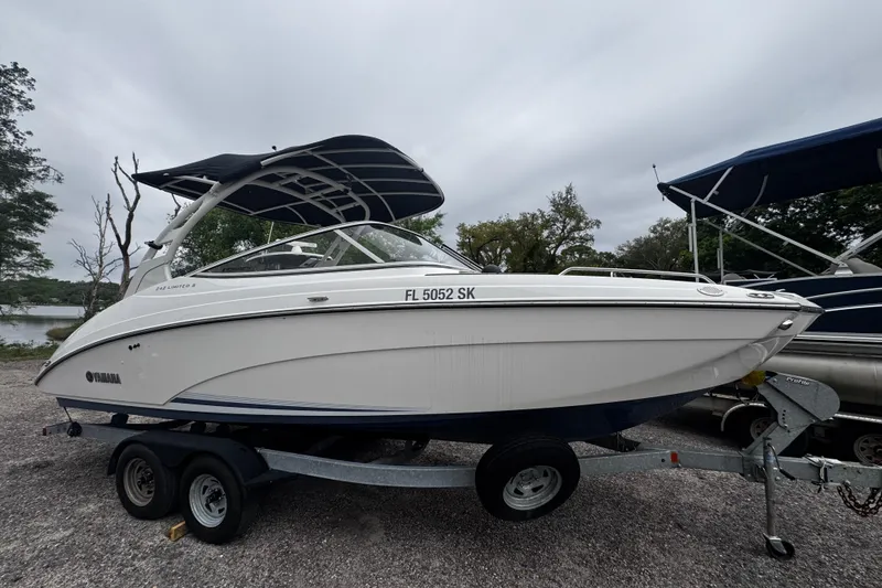 Slide: The Image of 2019 Yamaha Boats 242 Limited S on trailer, parked outdoors. - 8