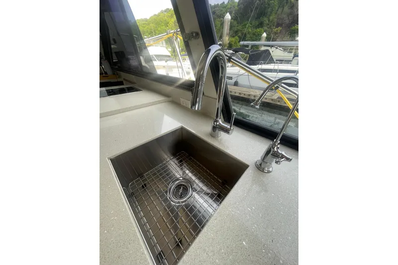 Slide: The Image of Stainless steel sink and faucet on 1986 Hi-Star 40 Flybridge yacht kitchen. - 13