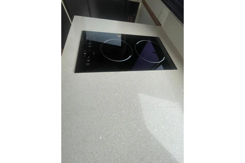 Slide: The Image of Modern electric cooktop on a sleek countertop in a 1986 Hi-Star 40 Flybridge yacht. - 14