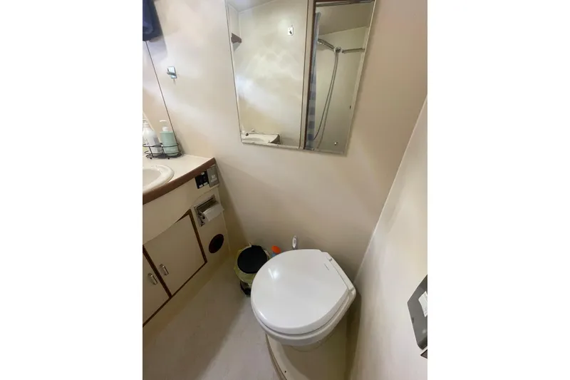 Slide: The Image of Bathroom interior of 1986 Hi-Star 40 Flybridge yacht with toilet and mirror. - 26