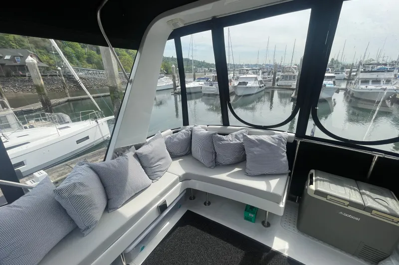 Slide: The Image of Cozy seating area on 1986 Hi-Star 40 Flybridge yacht, overlooking marina. - 34