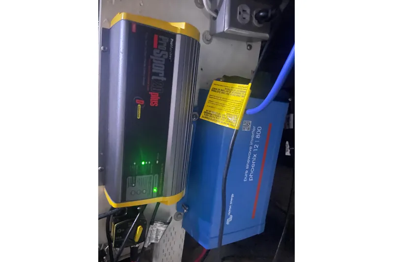 Slide: The Image of Battery chargers and inverter setup on a 1986 Hi-Star 40 Flybridge boat. - 41