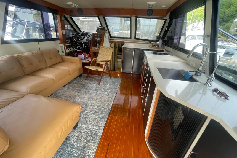 Slide: The Image of Interior of 1986 Hi-Star 40 Flybridge yacht with modern kitchen and seating area. - 7