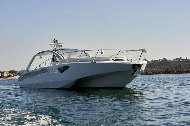 Slide: The Image of 2017 Tritons Express Cruiser Crossover on calm water, showcasing sleek design and modern features. - 10