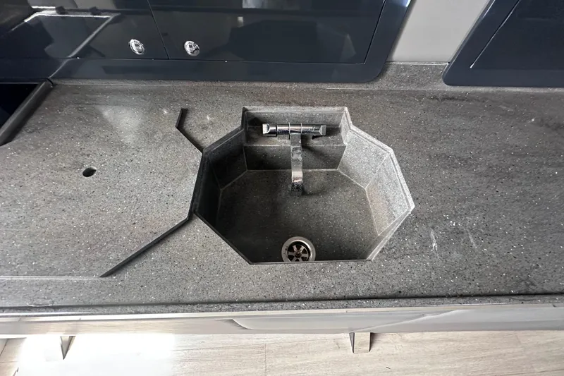 Slide: The Image of Modern octagonal sink on a sleek countertop in a 2017 custom express cruiser crossover. - 18