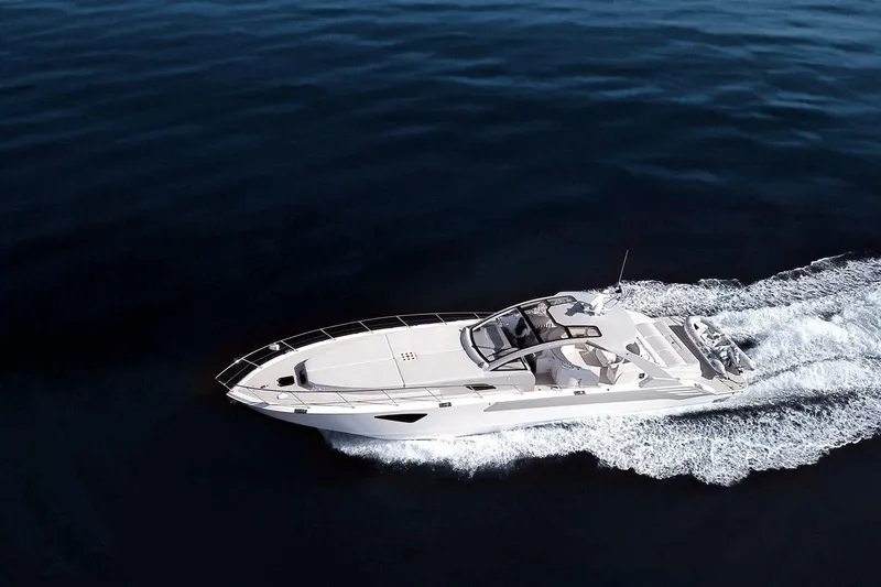 Slide: The Image of 2017 Tritons Express Cruiser Crossover navigating on open water. - 2