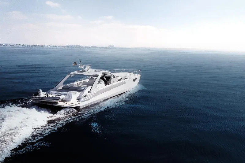 Slide: The Image of 2017 Tritons Express Cruiser Crossover navigating calm ocean waters under a clear sky. - 3