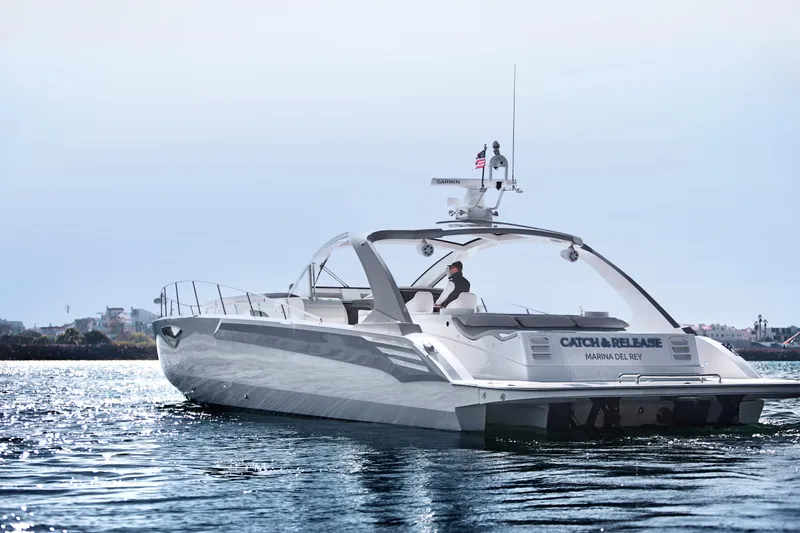 Slide: The Image of 2017 Tritons Express Cruiser Crossover on water, featuring sleek design and modern amenities. - 4