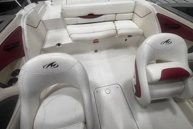 Slide: The Image of 2008 Monterey 194FS boat interior with white and red seating, featuring logo-embossed chairs. - 10