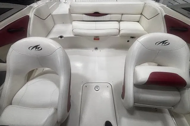 Slide: The Image of Interior of a 2008 Monterey 194FS boat with white and red seating. - 11