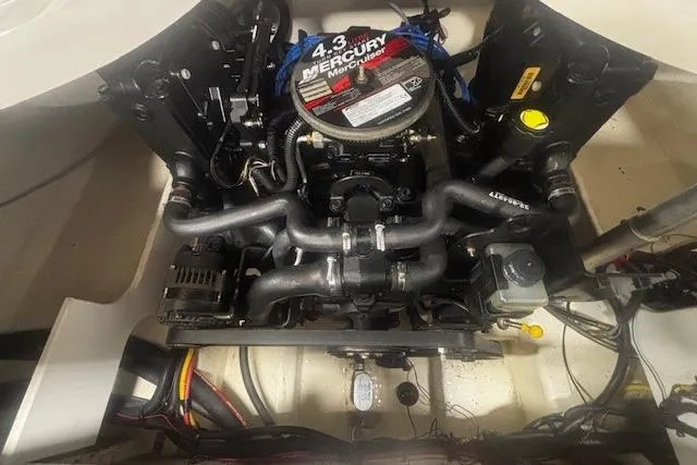Slide: The Image of Engine compartment of a 2008 Monterey 194FS boat featuring a 4.3L Mercury engine. - 19