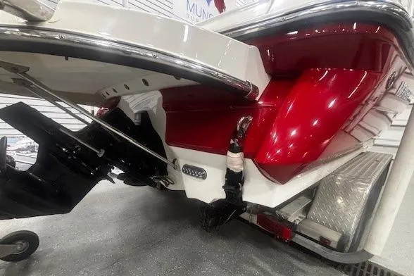 Slide: The Image of 2008 Monterey 194FS boat, red and white hull, displayed indoors. - 27