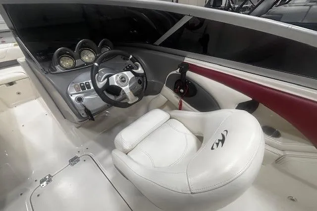 Slide: The Image of 2008 Monterey 194FS boat interior with steering wheel and white seating. - 30